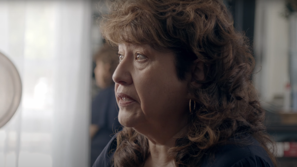 Woman in profile during a documentary interview